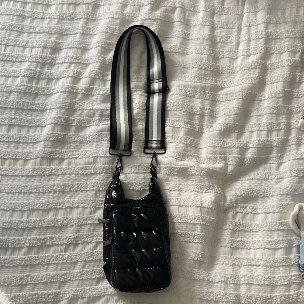 Glossy Black Crossbody Bag with Striped Strap